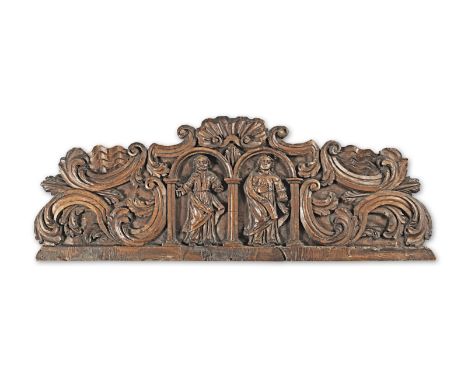 A carved beech overdoor, possibly SpanishCarved with Saint Peter and a female saint with book, each standing beneath an arch,