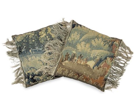 A large pair of cushions made from 17th century verdure tapestry, FlemishEach woven in a leafy-design in green and burnt-sien