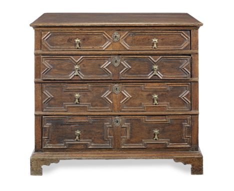 A Charles II joined oak chest of drawers, circa 1680The boarded top with applied moulded edge, above four long and graduated 