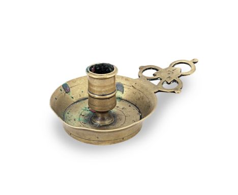 A rare late 17th century cast brass socket chamberstick, with porringer-type handle, English, circa 1700, with (indistinct) m