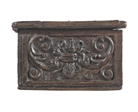 A rare and documented boarded oak box, probably Northern German, circa 1600The lid carved to its centre with a gentleman wear