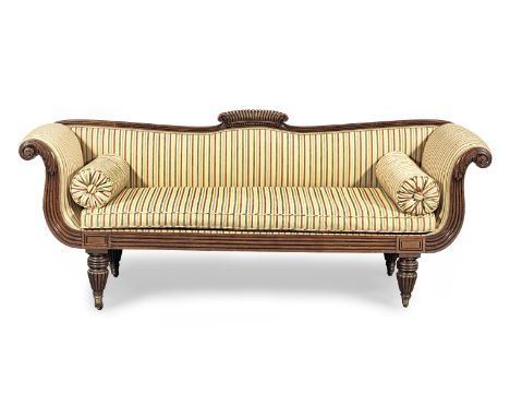 A William IV mahogany framed sofa, circa 1830Having a slightly dished and scroll-carved cresting, and scroll-over leafy and r