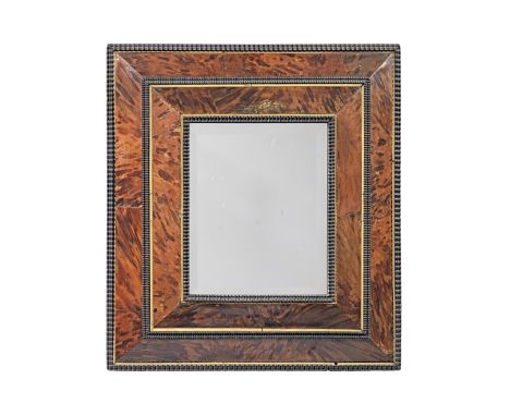 A turtleshell and ebonised wall mirror, in the 17th century Flemish styleThe rectangular plate with bevelled edge framed by t