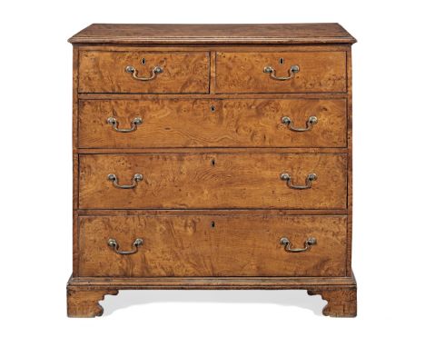 A George III joined figured-elm chest of drawers, circa 1780The top of two boards with applied moulded edge, over two short a