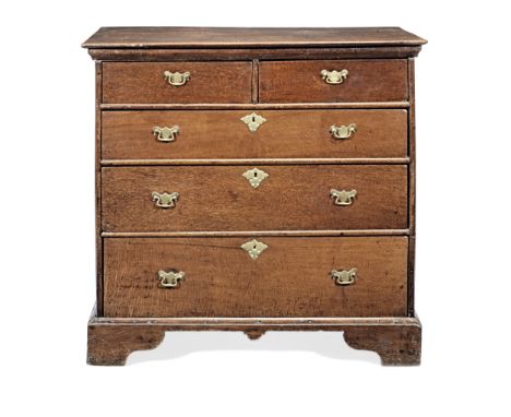 A George II joined oak chest of drawers, circa 1730The top of two boards with rounded under-edge, above two short and three l