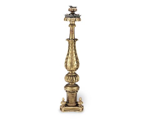 An 18th century floor-standing giltwood torchere, North ItalianWith a gadrooned socket, above a lotus-leaf carved lambrequin 