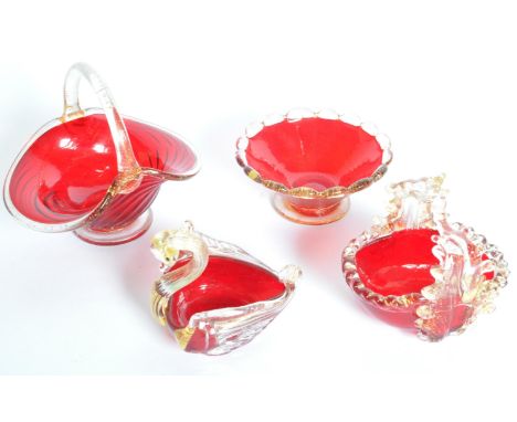 A collection mid 20th Century of ruby red Venetian Murano cut glass bowls. In the shape of a swan, poppy and pulled glass lea