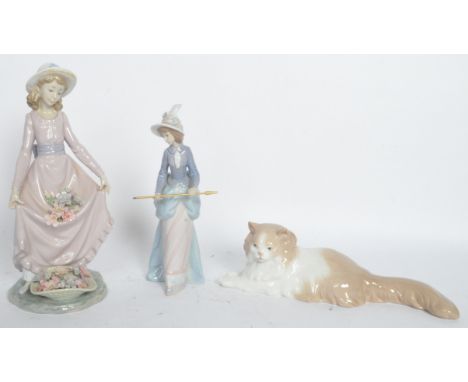 Lladro &amp; Nao - An assortment of three vintage 20th century Spanish bone china figurines to include a a lladro lady figure