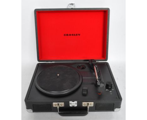 A vintage 20th century audio Hi-Fi Crosley Cruiser 3-speed portable turntable vinyl record player in a black carry case. Come