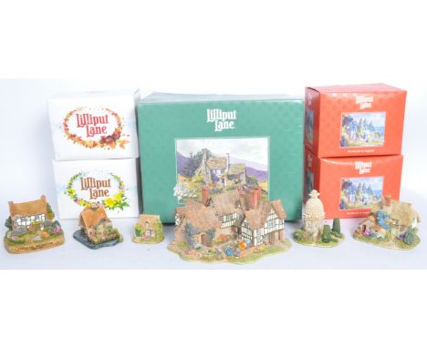 A collection of vintage 20th century Lilliput Lane sculpture figures to include The Almonry 119, Acorn Cottage, Thirty Years 