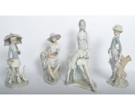 A collection of four 20th century porcelain figurines comprising of two Lladro figurines of a girl with geese, a lady with an