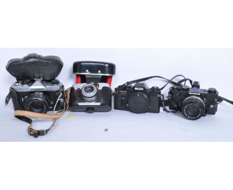 A collection of&nbsp; vintage 20th century photographic cameras and lenses to include an Olympus OM-1 camera body no. 1743791