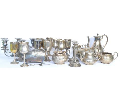 A large collection of 20th century silver plate to include candlesticks, goblets, a tea caddy, a teas service and more.&nbsp;