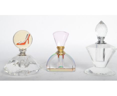 A collection of three vintage 20th century Art Deco style perfume bottles having a polychrome example, one having a faceted s