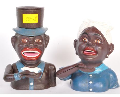 Two&nbsp; 20th century&nbsp;cast iron pull lever money banks in the form of an African American woman and man. Lever to the b