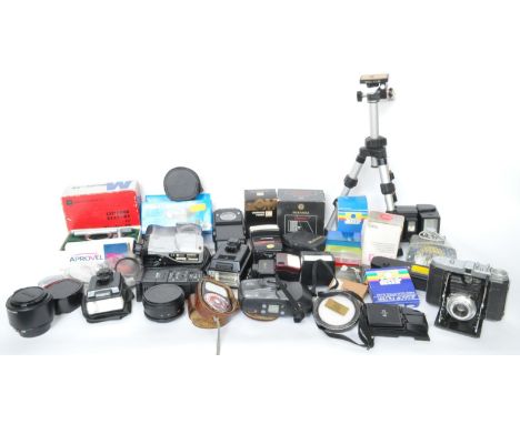 A large collection of vintage 20th century photographic camera equipment and accessories to include video lights, filters, fl