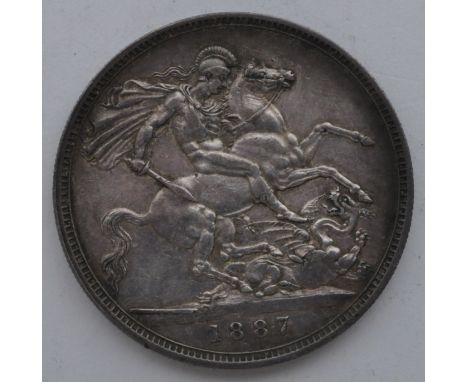 A 19th century Victorian 1887 silver crown coin with Queen Victoria old head bust and St George to verso. Measures 41mm diame