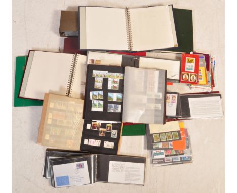 A collection of vintage 20th century UK and international stamps. Collection includes franked and unfranked examples. Stamps 