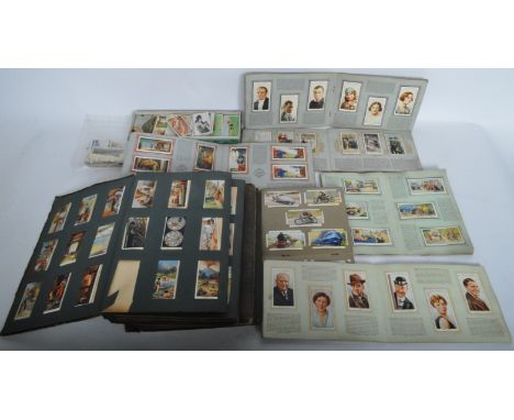 A collection of vintage 20th century cigarette cards to include Radio Celebrities, Air Raid Precautions, Safety First, Reign 