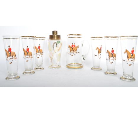 A set of six vintage retro mid 20th century drinking glasses with cocktail shaker. Each piece having a transfer printed featu