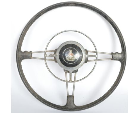 Of Automobile interest - a vintage 20th century Morris Minor steering wheel having a circular shield insignia to the centre, 