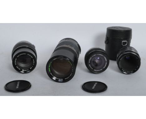 A collection of vintage 20th century camera lens to include a Tamron Zoom Macro 1 : 4.5 f = 85~210mm 55mm no.7718253, an Olym