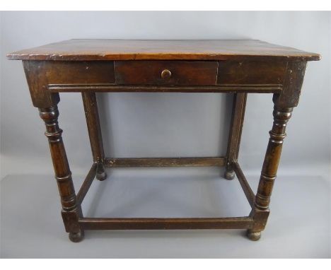 An Antique Tilt-topOak Wine Table. The table on turned support with tripod base, approx 56 cms dia.&nbsp;