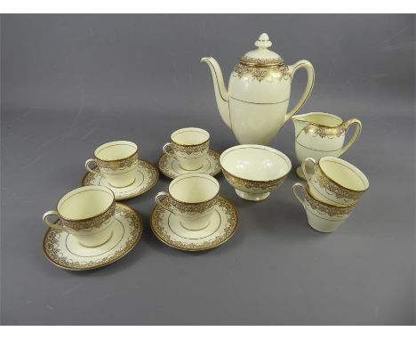 A Royal Doulton 'Gold Lace' Coffee Set, comprising coffee pot, sugar bowl, milk jug (af), six demi-tasse and six saucers, pat