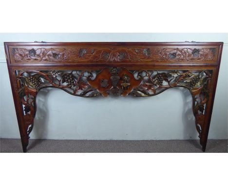 A Late 19th Century Oriental Beechwood Decorative Carved Wall Panel/Bed Head, the upper section carved with vine tendrils and