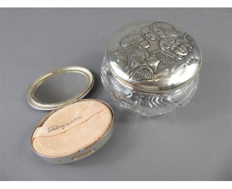 An American Silver Compact, oval with engine turned decoration, together with a silver topped cut glass powder bowl. (2)