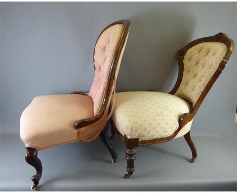 An Antique Button Back Nursing Chair with cabriole legs on brass casters and&nbsp;covered in shell pink fabric together with 