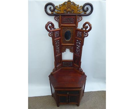 A Late 19th Century Chinese Teak Hall Stand, the hall stand with intricate carving depicting mythical and figural characters,