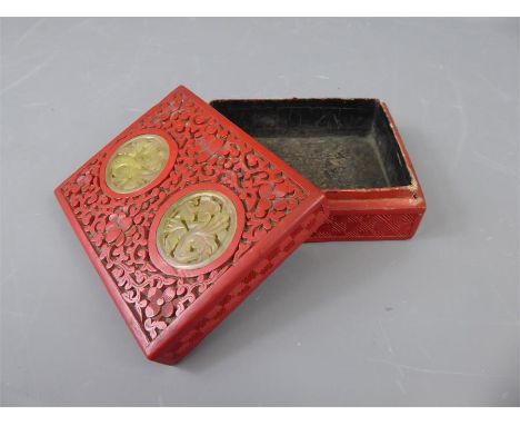 A Chinese Red Lacquer Cinnabar Trinket Box, the intricately carved box with two jade medallions to the lid, approx 13 x 10 cm