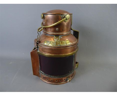 An Antique Copper Ship's Oil Lamp, having Red/Blue glass and 'Starboard' and 'Port' plaques to sides, hinged chimney top and 