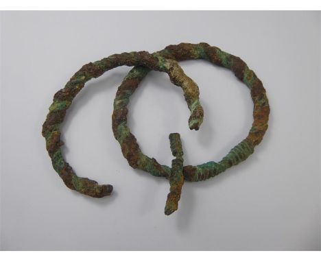 Egyptian Artefact, a braided and worked bangle, approx 9 cms diameter, approx 66.5 gms together with one other (af). Collecti