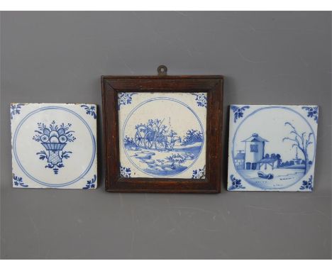 Three 18th Century English Delftware Tiles. The blue and white tiles depicting a wagon scene, a bouquet of flowers and a farm