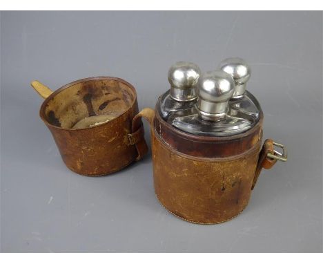 A Glass and Silver Triple Hip Flask Set, Chester hallmark, marks rubbed, presented in the original cylindrical leather box. T