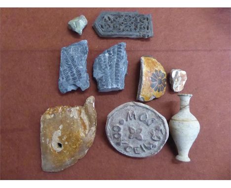 Archaeological Finds, including terracotta fragments, wood carved hand, wood carved panel with decorative carving an antique 