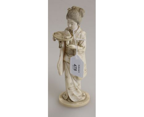 Masatada, a Japanese Meiji period, carved ivory okimono in the form of a geisha kimina, with floral kimono with drum shaped (