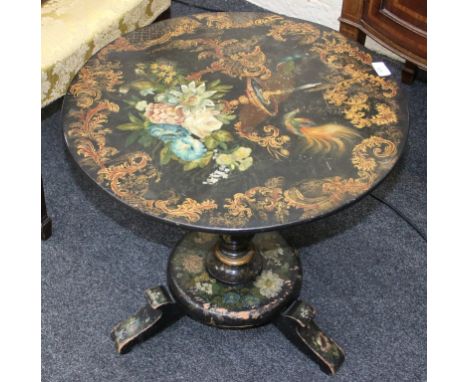 A Victorian black papier mache snap top tripod table, painted with trellis, flowers and a fountain, the circular top over a t