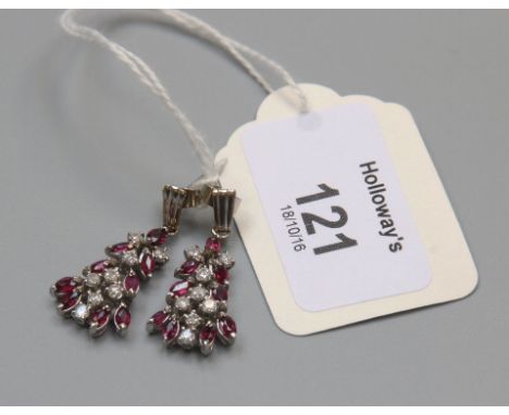 A pair of ruby and diamond pendant earrings, the mixed single cut diamonds and marquise shaped rubies in flaring cascade