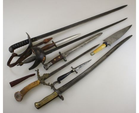 A 19th century English sabre, with bowl hilt and straight fullered blade, probably a Volunteer Regiments Officers unofficial 