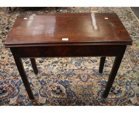 A George III mahogany gate leg supper table, the rectangular folding top with moulded edge on inner chamfered moulded square 