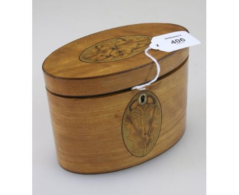 An early 19th century satinwood inlaid and strung tea caddy, of oval form, the hinted lid and front decorated with leafy this