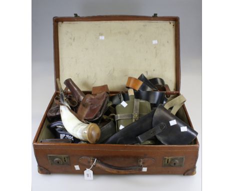A collection of military leather ammunition pouches, belts, pistol holders and other items