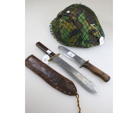 An early 20th century heavy bladed Bowie knife and scabbard, with hardwood grip, together with a British Rogers of Sheffield 