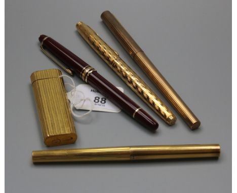 A gold plated Cartier Paris lighter, oval reeded form, signed and numbered to the base, together with a Dupont silver fountai