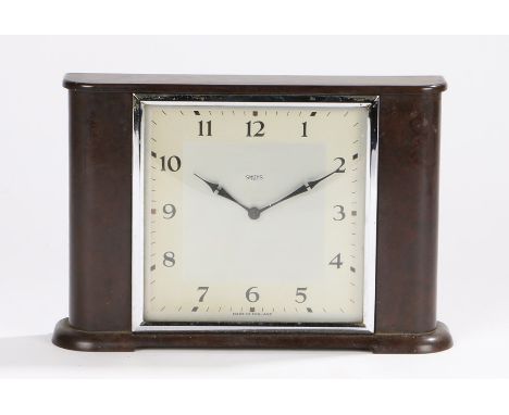 Smiths bakelite mantel clock, the white and silver effect square dial with Arabic numerals, on a shaped plinth base, 23cm wid