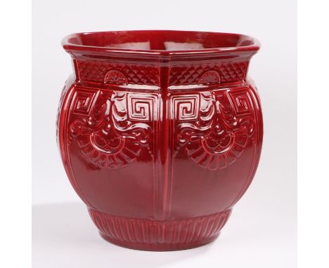 Large Arts and Crafts red glazed hexagonal jardiniere, possibly Burmantofts, the body with scale and scroll decoration, 36cm 