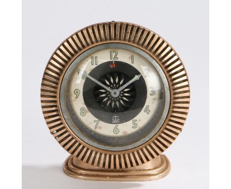 20th Century Equity alarm clock, housed in a copper effect reeded case, the dial with Arabic numerals and central rotating bl